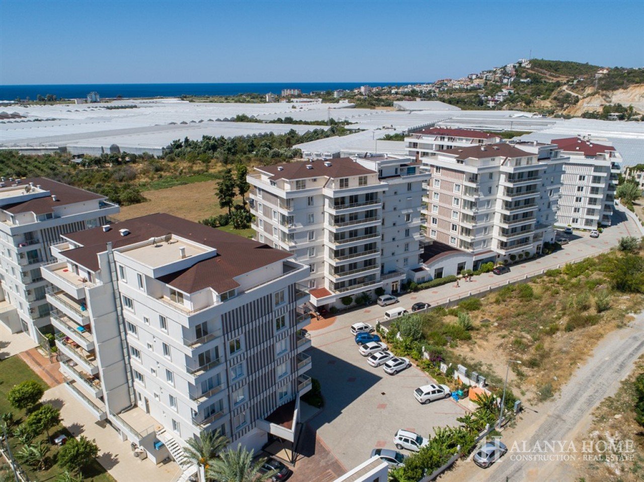 Фото купить продать недорогую квартиру недвижимость в доме жилом комплексе с видом на море Алания Хо